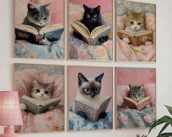 May include: Six framed art prints featuring cats reading books in bed. Each cat is depicted in a cozy setting with floral bedding and a soft pink background. The cats vary in color and breed.