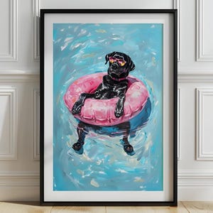 May include: Framed art print of a black Labrador Retriever wearing sunglasses and relaxing in a pink inflatable ring in a pool. The dog is the focal point against a backdrop of blue water with white highlights.