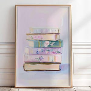 May include: A stack of vintage books with floral designs on a light purple background. The books are in various shades of pink, blue, and green.