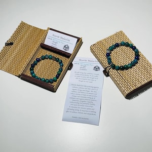 Gemstone 8mm Bracelet with Stainless Steel All Seeing Eye Bead with the description of the stone in a Beautiful Bamboo Giftbox