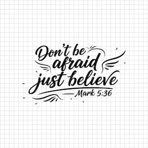 May include: Black script text on a white background reads "Don't be afraid just believe" with the reference "Mark 5:36". The design includes decorative wing and flourish elements.