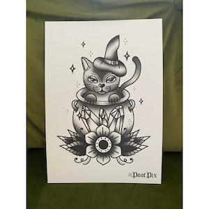 May include: Black and white illustration of a witch cat wearing a pointed hat and sitting inside a cauldron with crystals and a flower.
