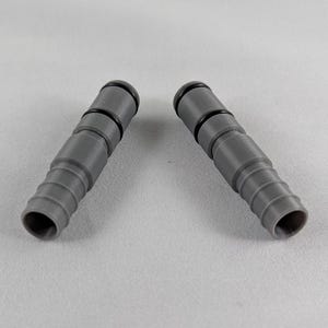 May include: Two grey plastic hose connectors with black rubber seals. The connectors are designed to join two hoses together.