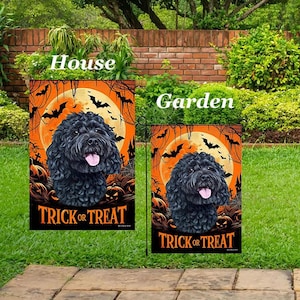 May include: Two Halloween-themed garden flags. The flags feature a black dog with its tongue out, set against an orange background with bats, a full moon, and pumpkins. The text "TRICK OR TREAT" is at the bottom.