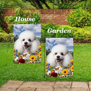 May include: Two rectangular garden flags featuring a white poodle with a happy expression, surrounded by sunflowers, butterflies, and other flowers against a blue sky background. The flags are labeled "House" and "Garden".