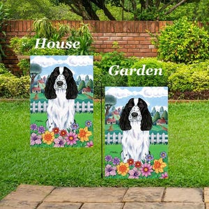 May include: Two decorative garden flags featuring a black and white English Springer Spaniel. The flags have the words "House" and "Garden" printed on them. The dog is surrounded by colorful flowers and a white picket fence.