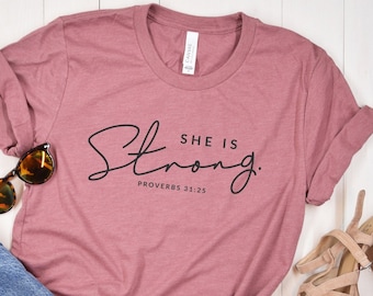 She is Strong T-Shirt - Proverbs 31:25 - Religious Women's Shirt - Strong Christian Woman - Faith Shirt for Women - Christian Shirt