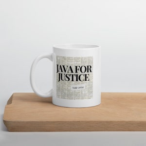 May include: White ceramic mug with a black and white newspaper print design. The text "JAVA FOR JUSTICE" is printed in bold black letters. Below the text is the phrase "Vote 2024" in smaller black letters.