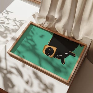 May include: A black cat wearing a slice of bread as a hat. The cat is on a teal green background.