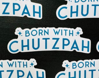 May include: Multiple white stickers with blue text that reads "Born with Chutzpah" with a small star on either side of the text.
