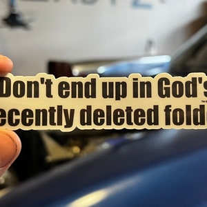 May include: A white sticker with black text that reads "Don't end up in God's recently deleted folder".
