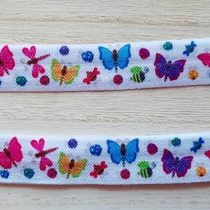 Diadema con implante coclear de mariposa