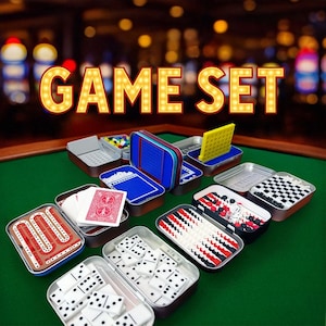 May include: A collection of various games in small metal tins, including dominoes, playing cards, and a checkerboard. The text "GAME SET" is displayed in illuminated letters above the games. The games are arranged on a green surface.