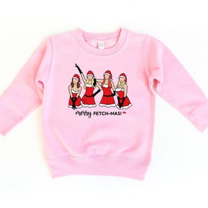 May include: Pink sweatshirt with a graphic of four women in Santa outfits with the text "merry fetch-mas!"