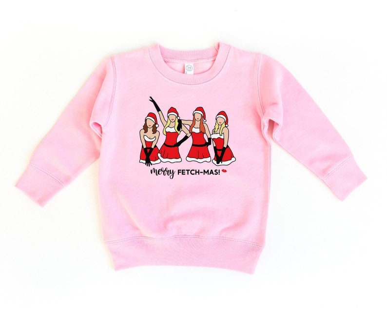 May include: Pink sweatshirt with a graphic of four women in Santa outfits with the text "merry fetch-mas!"