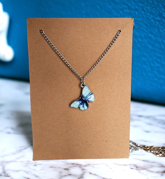 Light blue butterfly necklace deals