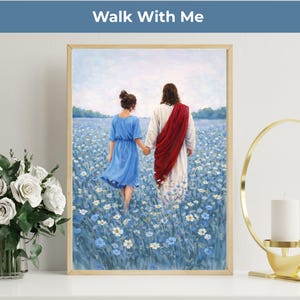 May include: Framed art print depicting two figures walking through a field of blue flowers. The figures are holding hands, with one wearing a blue dress and the other a white robe with a red sash. The text "Walk With Me" is at the top.