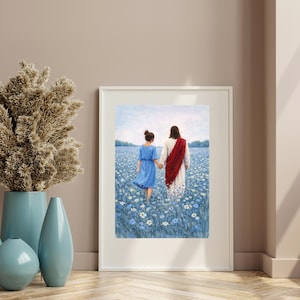 May include: A framed art print depicts two figures walking through a field of blue flowers. One figure wears a blue dress, the other a white robe with a red sash. A tall, dried floral arrangement and blue vases are in the foreground.