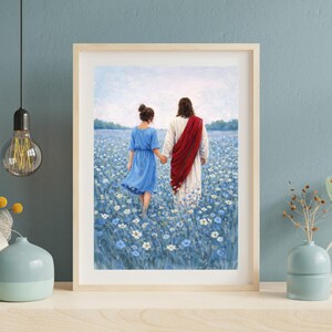 May include: Framed art print depicting two figures walking through a field of blue flowers. One figure wears a blue dress, the other a white robe and red sash. The artwork is displayed on a wooden shelf.