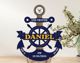 May include: A blue and gold wooden anchor with a ship's wheel, the text "USS TRITON", "DANIEL", "SHIP 12", "DIV 946", and "PIR 12/24/2024".