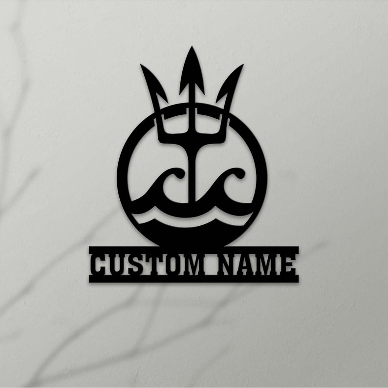May include: Black metal wall decor featuring a circle with a trident and waves inside, and a personalized nameplate below. The nameplate reads "CUSTOM NAME".