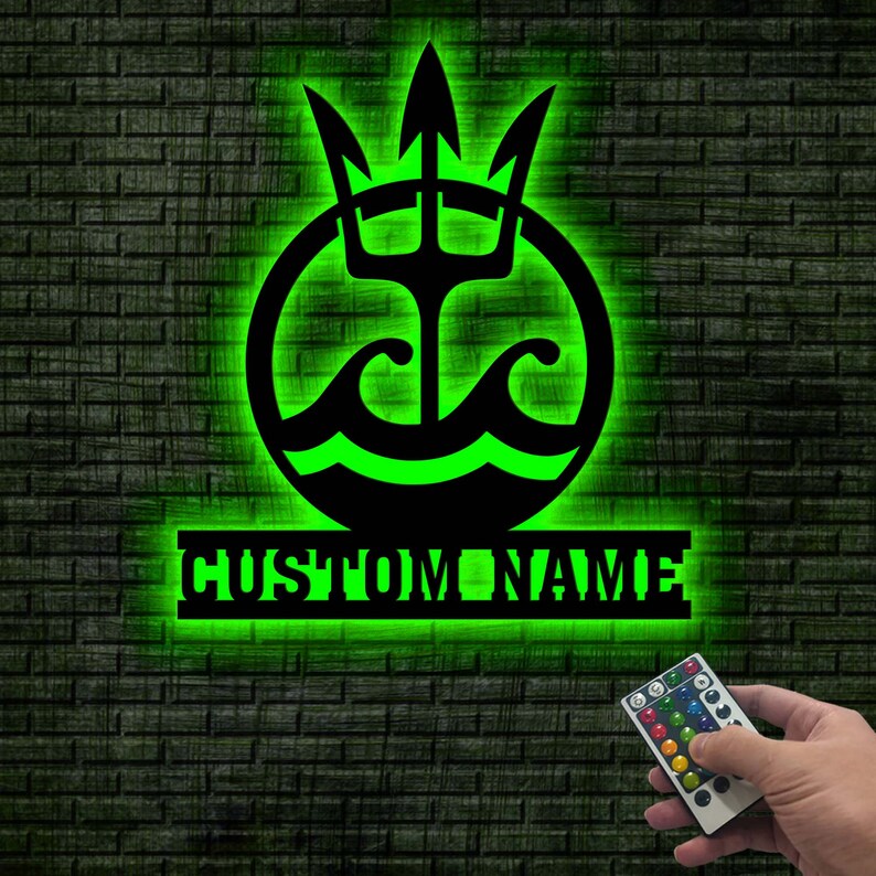 May include: Green neon sign with a trident and waves in a circle, with the text "CUSTOM NAME" below. A remote control with multiple colored buttons is in the lower right corner.