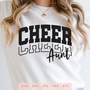 May include: White sweatshirt with black text that reads "Cheer Crazy Aunt".