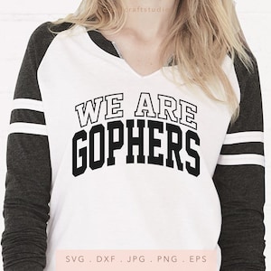 May include: A white shirt with black and white striped sleeves. The shirt has the text "WE ARE GOPHERS" printed on the front in black.