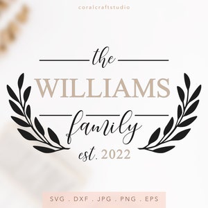 May include: Black and white graphic design featuring a wreath with the text "the WILLIAMS family est. 2022".