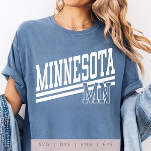 May include: A blue t-shirt with white text that says "Minnesota MN".