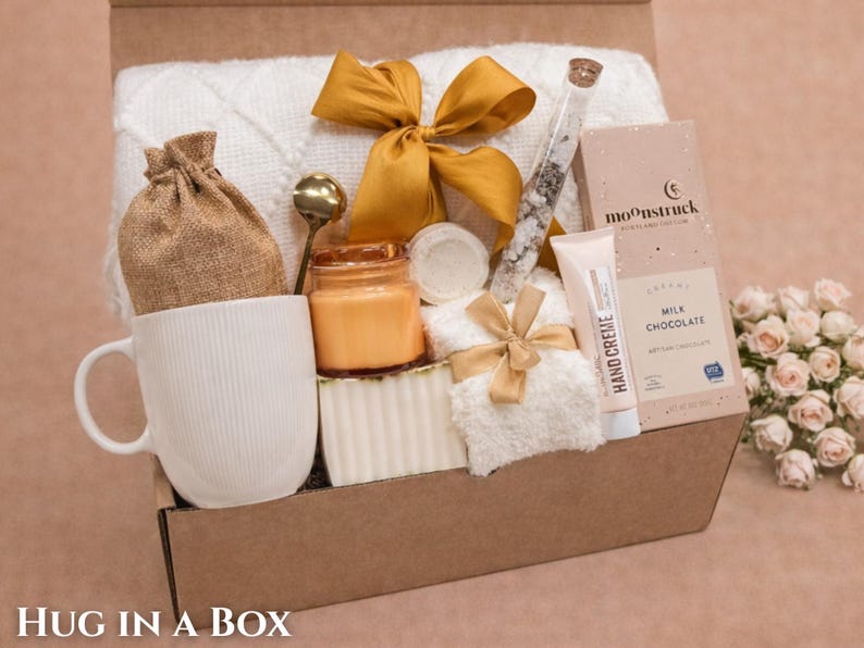 Aesthetic spa gift basket with a plush comfort throw for ultimate relaxation.