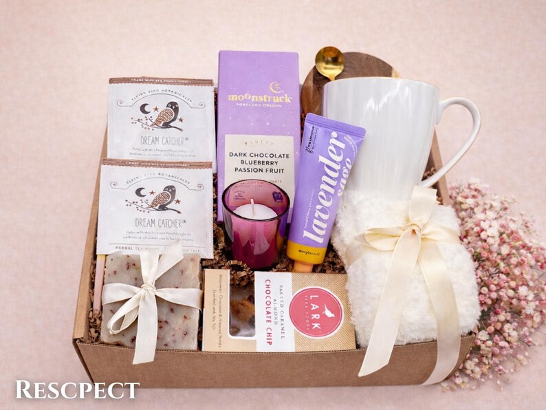 Wellness gift box for women with natural skincare and a warm cozy blanket.