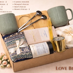 Love Birds gift box with romantic tones, matching items for couples, cozy blanket and treats arranged in a kraft box