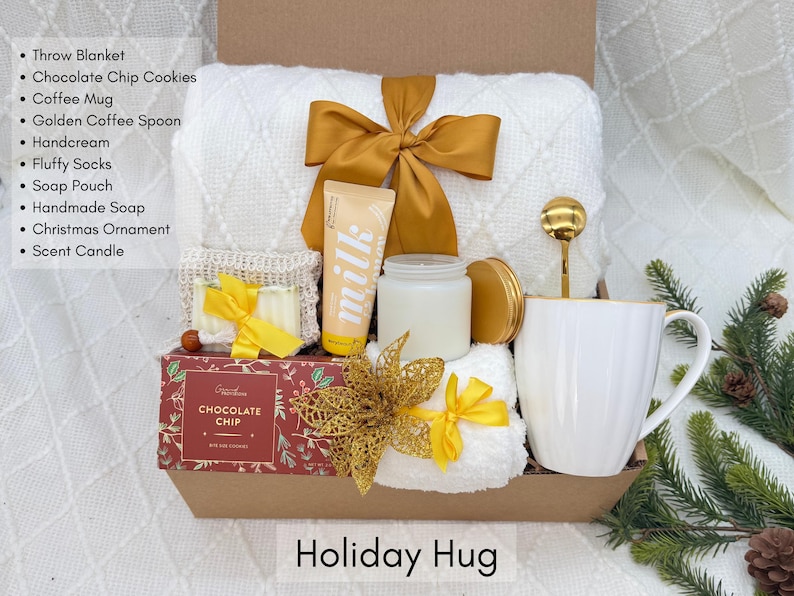 Cozy Christmas gift box with blanket, candle and holiday treats, ready to gift
