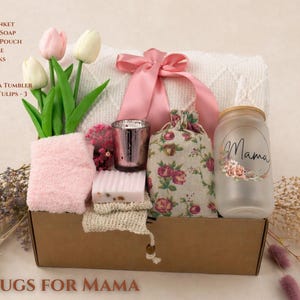 Hugs for Mama Mother’s Day gift box with soft blanket, pink ribbon, cozy socks, handmade soap, candle holder, floral pouch and Mama glass cup