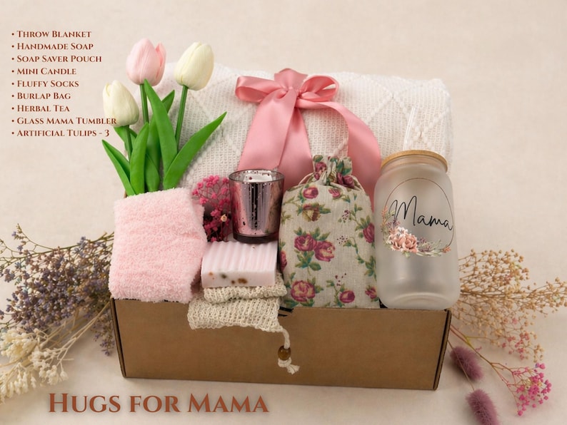Hugs for Mama Mother’s Day gift box with soft blanket, pink ribbon, cozy socks, handmade soap, candle holder, floral pouch and Mama glass cup