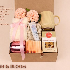 Aesthetic "Blush & Bloom" Pink Gift Basket for Her, including floral skincare, a pink ceramic mug, and silk accessories.