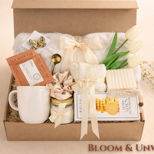 Bloom and Unwind after surgery gift box for her with cozy throw blanket, tea mug, candle, fluffy socks, handmade soap, lemon shortbread cookies and tulips in kraft box perfect self care get well soon gift for women
