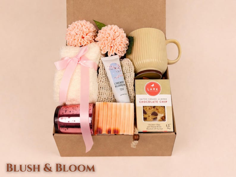 Blush and Bloom birthday gift box for her with fluffy socks, handmade soap, candle, tea mug, cookies, hand cream and pink floral spa gifts in kraft box perfect birthday care package for women