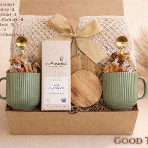 Good Time gift box with snacks, mug and cozy essentials arranged in a kraft box, a fun new home gift for homeowners