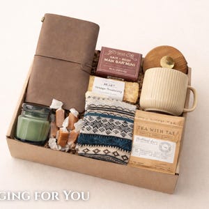 Employee appreciation gift basket with a premium leather journal and pen.