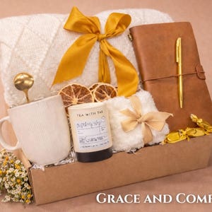 Sympathy gift box with cozy white blanket and candle for bereavement and comfort during difficult times