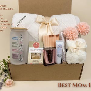Premium "Best Mom Ever" Gift Basket including a cozy throw blanket, glass tumbler, and relaxation items in a curated gift box.