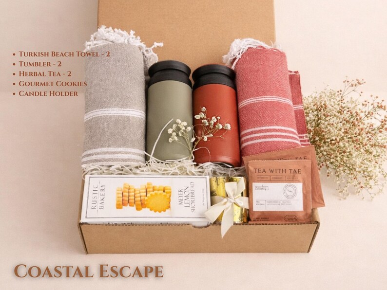 Coastal Escape gift box with soft blue tones, spa items, candle and relaxing essentials in a kraft box inspired by a beach theme