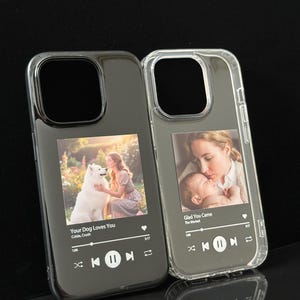 May include: Two phone cases, one black and one clear, each with a custom photo and a music player interface. The black case shows a woman with a white dog, the clear case shows a mother and baby.
