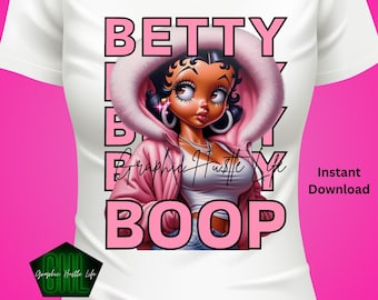 May include: A white t-shirt with a pink graphic design featuring a cartoon character with a pink jacket and the text "BETTY BOOP" in pink letters. The text "Graphic Hustle Life" is also included in the design.