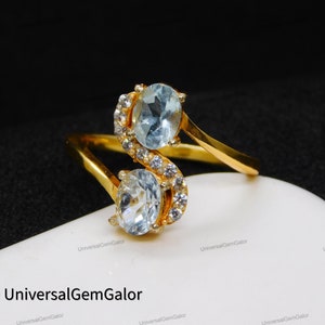 Anillo con letra inicial• Anillo de compromiso con vástago retorcido de aguamarina natural• Anillo de diamantes de doble piedra• Anillo de promesa• Anillos con piedra natal de marzo