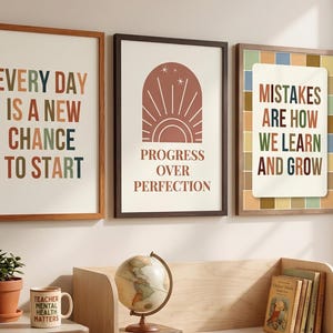 May include: Three framed wall art prints with motivational text. The left print reads EVERY DAY IS A NEW CHANCE TO START. The center print features an arch graphic with the text PROGRESS OVER PERFECTION. The right print reads MISTAKES ARE HOW WE LEARN AND GROW.