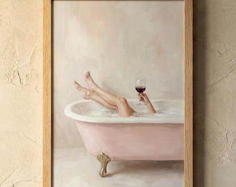 May include: A framed artwork depicts a person relaxing in a pink clawfoot bathtub filled with bubbles, holding a glass of red wine. The artwork has a light color palette and a wooden frame.
