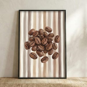 May include: A framed art print featuring a cluster of roasted coffee beans. The beans are a rich brown color, set against a backdrop of vertical stripes in shades of beige and brown. The artwork is displayed in a black frame.